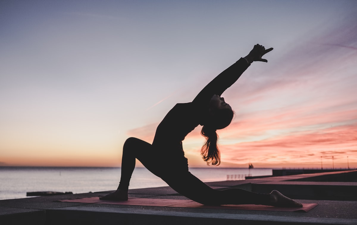 Group yoga session on mats in a bright studio — starting yoga in Malaysia